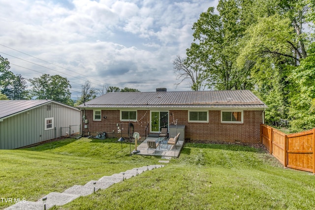 963 NE Woodlawn Ter, Abingdon, VA 24210 - rear view of house featuring metal roof, a patio, and brick siding