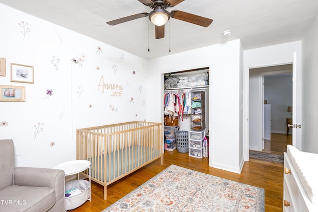 963 NE Woodlawn Ter, Abingdon, VA 24210 - bedroom with a closet, wood finished floors, a nursery area, and a ceiling fan