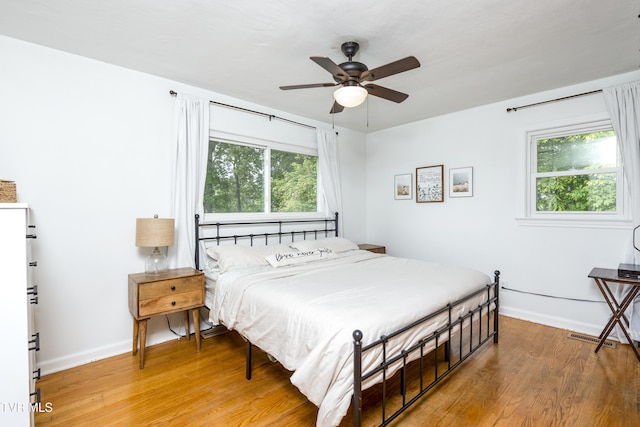 963 NE Woodlawn Ter, Abingdon, VA 24210 - bedroom featuring baseboards, light wood-style floors, and a ceiling fan