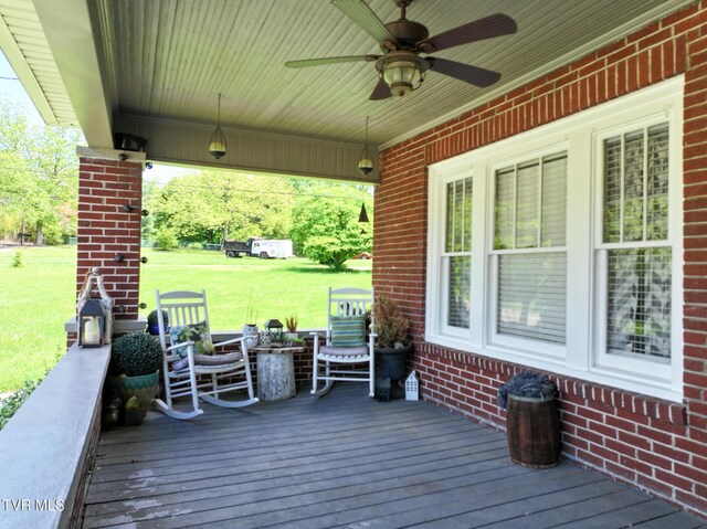 408 N Main St, Greeneville, TN 37745 - deck featuring a ceiling fan and a lawn