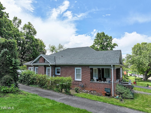 408 N Main St, Greeneville, TN 37745 - view of front of house with brick siding, a shingled roof, and a porch