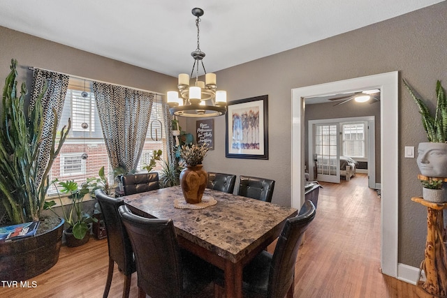 408 N Main St, Greeneville, TN 37745 - dining room with a chandelier, wood finished floors, a textured wall, and baseboards