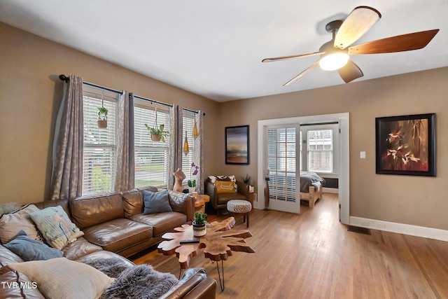 408 N Main St, Greeneville, TN 37745 - living area featuring light wood-style floors, a ceiling fan, and baseboards