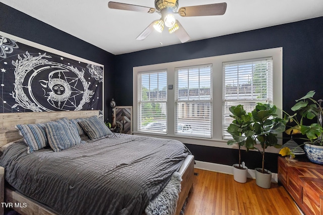 408 N Main St, Greeneville, TN 37745 - bedroom with multiple windows, wood finished floors, baseboards, and a ceiling fan