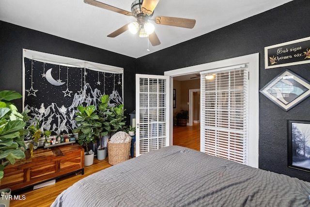 408 N Main St, Greeneville, TN 37745 - bedroom featuring wood finished floors, a textured wall, and a ceiling fan