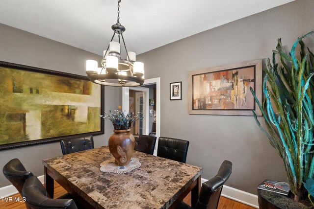 408 N Main St, Greeneville, TN 37745 - dining area with wood finished floors, a chandelier, and baseboards