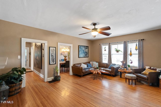 408 N Main St, Greeneville, TN 37745 - living room featuring light wood-style flooring, ceiling fan, and baseboards
