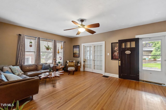 408 N Main St, Greeneville, TN 37745 - living room featuring light wood-type flooring, a ceiling fan, and baseboards