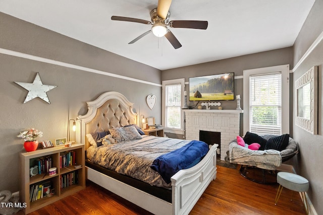 408 N Main St, Greeneville, TN 37745 - bedroom with wood finished floors, a fireplace, and a ceiling fan