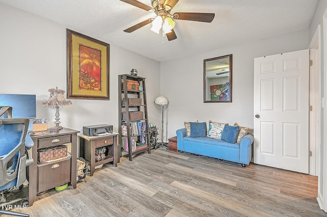204 E Mountain View Rd # 20, Johnson City, TN 37601 - sitting room featuring wood finished floors, ceiling fan, and a textured ceiling