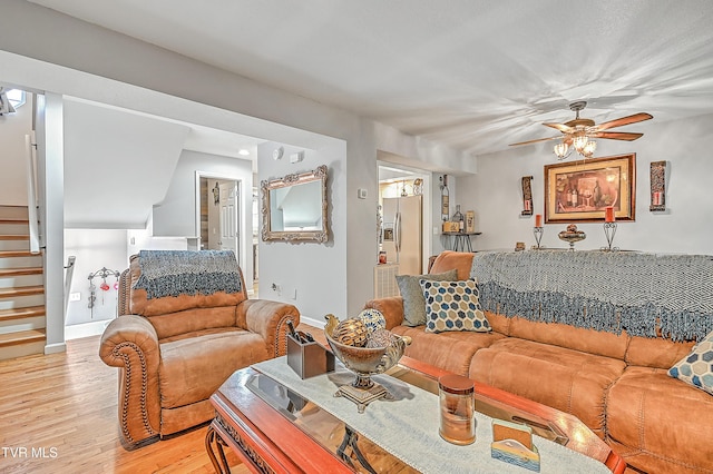 204 E Mountain View Rd # 20, Johnson City, TN 37601 - living room featuring stairs, light wood-type flooring, baseboards, and a ceiling fan