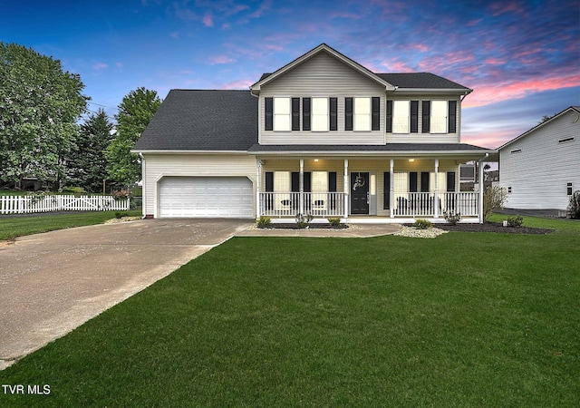 view of front facade with a porch, concrete driveway, and a garage