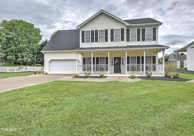 colonial house with a porch, driveway, and an attached garage