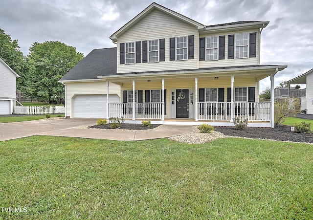 colonial inspired home with covered porch, concrete driveway, a front yard, and a garage