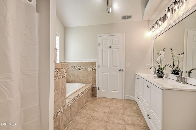 full bathroom with a garden tub, double vanity, and lofted ceiling