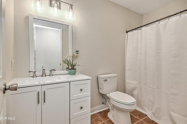 bathroom with tile patterned floors, toilet, vanity, and a shower with shower curtain