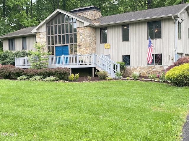 203 Oak Ln, Johnson City, TN 37604 - rear view of house with stone siding, a lawn, a deck, roof with shingles, and a chimney