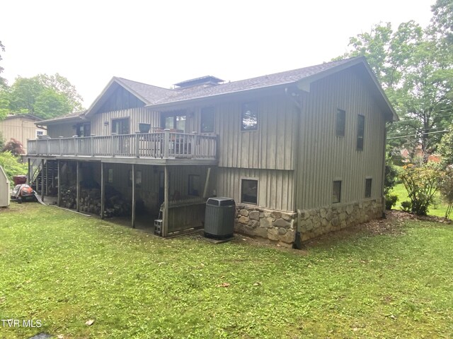 203 Oak Ln, Johnson City, TN 37604 - back of property featuring central AC, a wooden deck, a yard, and stone siding