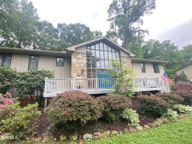 203 Oak Ln, Johnson City, TN 37604 - back of house featuring stone siding, a wooden deck, and board and batten siding