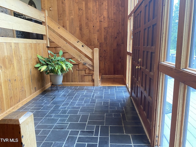 203 Oak Ln, Johnson City, TN 37604 - foyer featuring wood walls, stone tile flooring, and baseboards