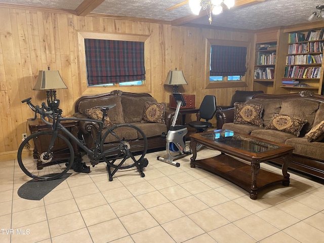 203 Oak Ln, Johnson City, TN 37604 - living room with a textured ceiling, a ceiling fan, wood walls, tile patterned floors, and crown molding
