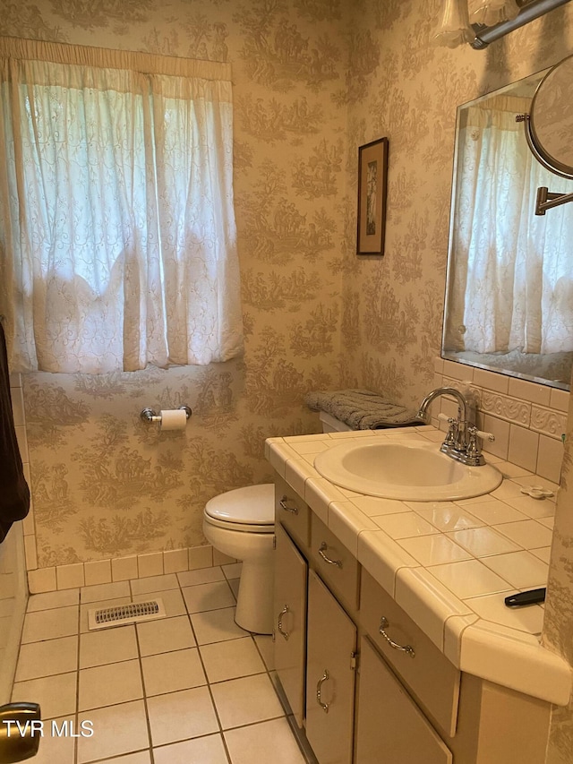203 Oak Ln, Johnson City, TN 37604 - bathroom with tile patterned flooring, toilet, vanity, and wallpapered walls
