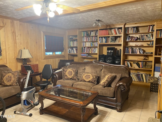 203 Oak Ln, Johnson City, TN 37604 - living room with ceiling fan, a textured ceiling, tile patterned flooring, and wood walls