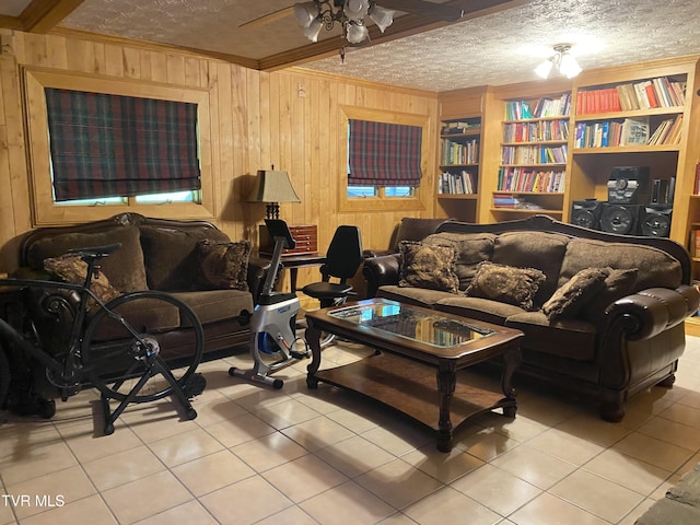 203 Oak Ln, Johnson City, TN 37604 - living room featuring crown molding, tile patterned floors, wood walls, a ceiling fan, and built in features