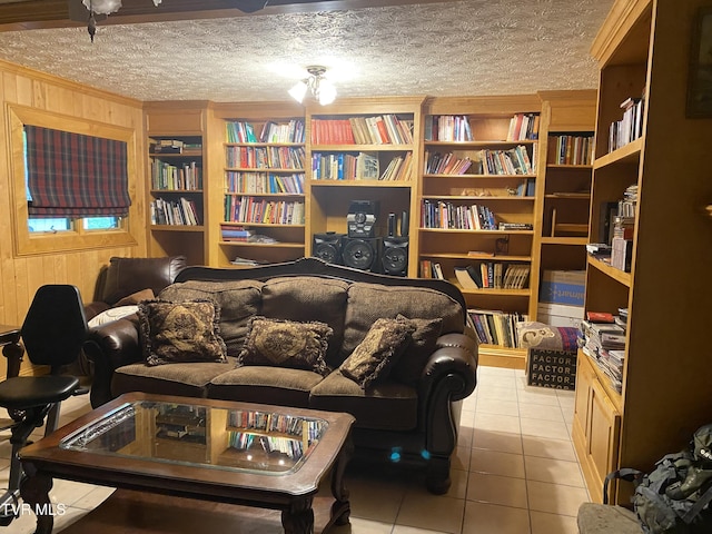 203 Oak Ln, Johnson City, TN 37604 - living area with tile patterned floors, a textured ceiling, crown molding, wooden walls, and built in features