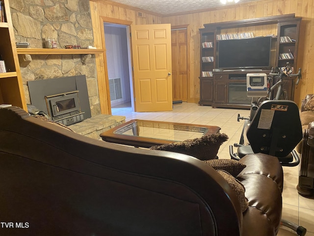 203 Oak Ln, Johnson City, TN 37604 - tiled living room featuring ornamental molding, a textured ceiling, and wood walls