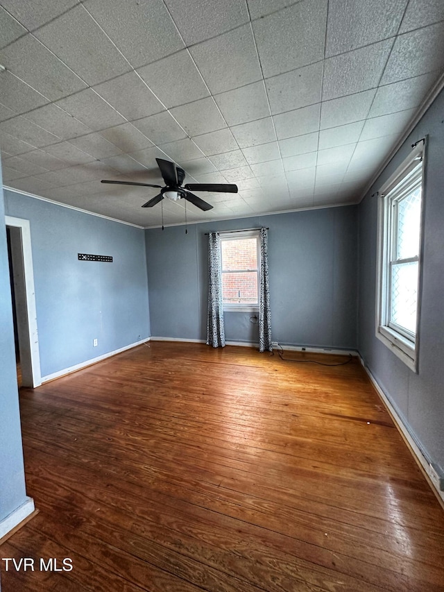 405 W Main St, Saltville, VA 24370 - unfurnished room with wood finished floors, a ceiling fan, and baseboards