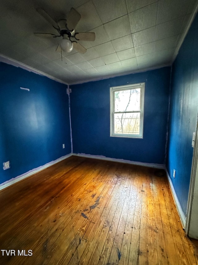 405 W Main St, Saltville, VA 24370 - spare room with a ceiling fan, hardwood / wood-style floors, and baseboards