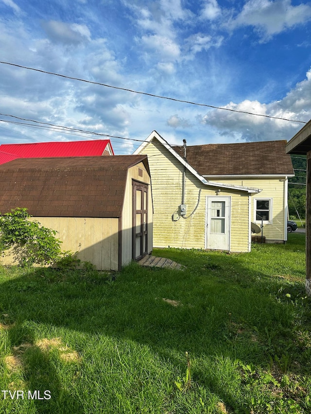 405 W Main St, Saltville, VA 24370 - back of property featuring a shed, a yard, and an outdoor structure