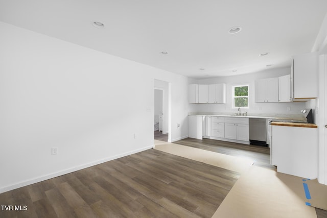 1410 Anderson St, Bristol, TN 37620 - kitchen with a sink, dishwasher, wood finished floors, white cabinetry, and recessed lighting