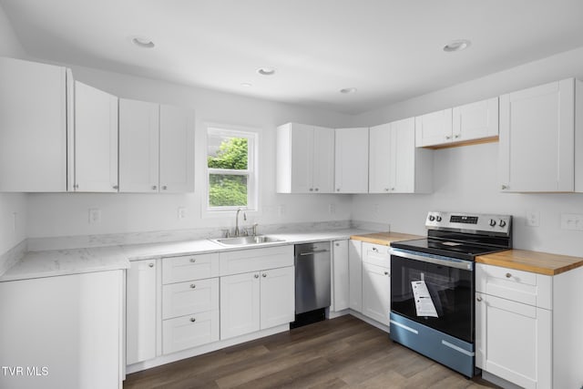 1410 Anderson St, Bristol, TN 37620 - kitchen featuring appliances with stainless steel finishes, a sink, recessed lighting, white cabinetry, and dark wood-style flooring