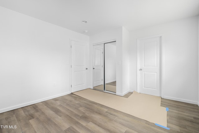 1410 Anderson St, Bristol, TN 37620 - unfurnished bedroom with wood finished floors, baseboards, and a closet