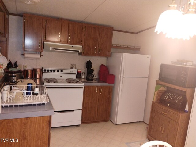 6560 Gilliam Rd, Wise, VA 24293 - kitchen featuring white appliances, ventilation hood, light flooring, brown cabinetry, and vaulted ceiling