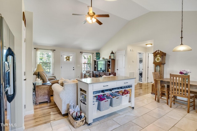 1086 Quaker Run, Telford, TN 37690 - kitchen featuring ceiling fan, open floor plan, decorative light fixtures, black fridge, and high vaulted ceiling