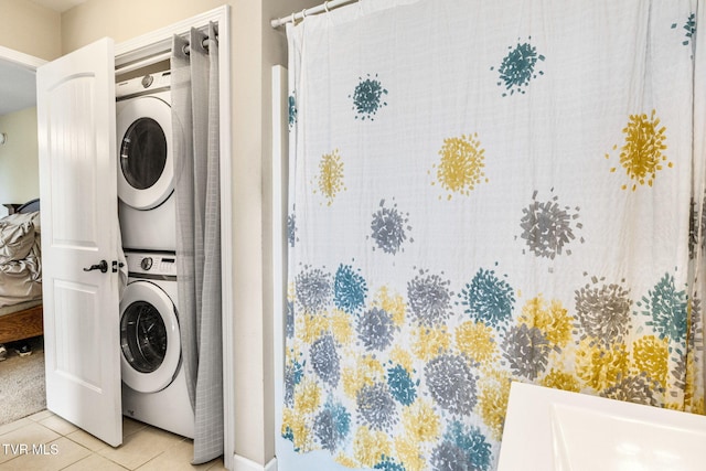 1086 Quaker Run, Telford, TN 37690 - laundry area with stacked washer / dryer and tile patterned flooring