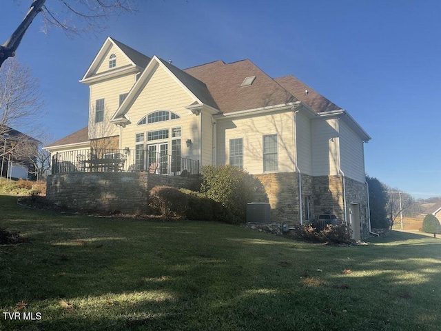 105 Ridgetop Dr, Johnson City, TN 37615 - view of property exterior featuring stone siding and a yard
