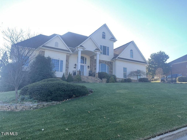 105 Ridgetop Dr, Johnson City, TN 37615 - traditional-style home with stone siding and a front lawn