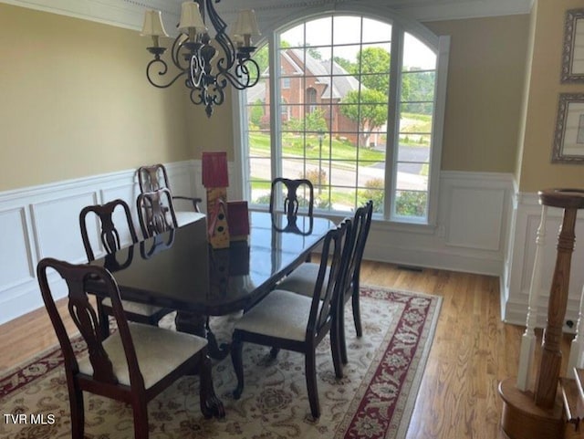 105 Ridgetop Dr, Johnson City, TN 37615 - dining space with a chandelier, a decorative wall, a wainscoted wall, light wood finished floors, and ornamental molding