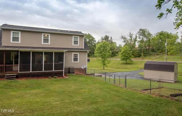 3493 Weaver Pike, Bristol, TN 37620 - back of property with a sunroom, a storage unit, central AC, and an outdoor structure