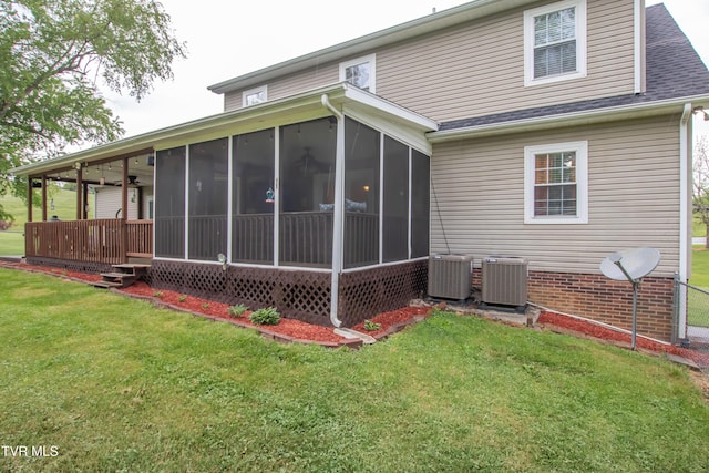 3493 Weaver Pike, Bristol, TN 37620 - rear view of house with central air condition unit, a sunroom, and a lawn
