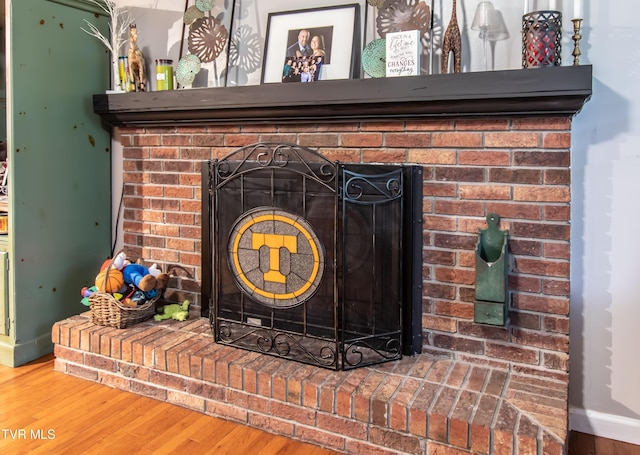 3493 Weaver Pike, Bristol, TN 37620 - detailed view of a brick fireplace and wood finished floors