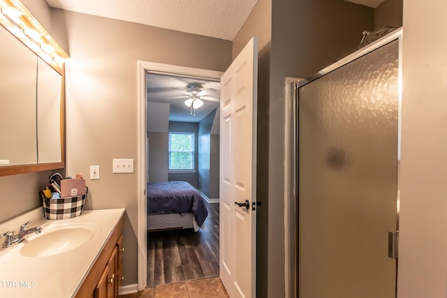 3493 Weaver Pike, Bristol, TN 37620 - full bath with ceiling fan, a stall shower, vanity, a textured ceiling, and connected bathroom