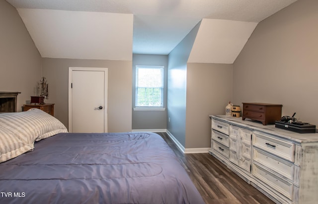 3493 Weaver Pike, Bristol, TN 37620 - bedroom featuring lofted ceiling, dark wood finished floors, and baseboards