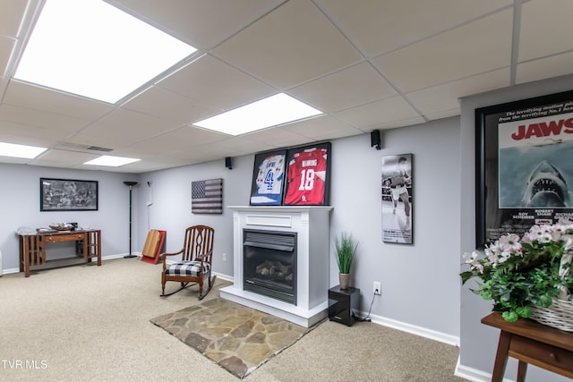 3493 Weaver Pike, Bristol, TN 37620 - sitting room featuring carpet, a paneled ceiling, a glass covered fireplace, and baseboards