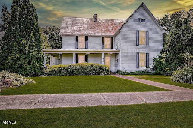 454 Cedar St, Bluff City, TN 37618 - view of front of home with a lawn, a chimney, and a porch