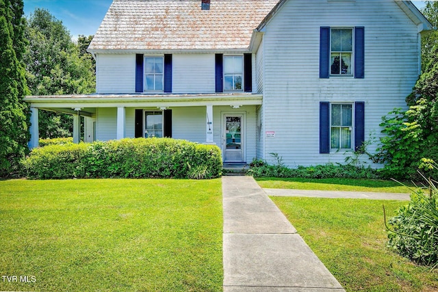 454 Cedar St, Bluff City, TN 37618 - view of front facade featuring a front yard, a chimney, and covered porch